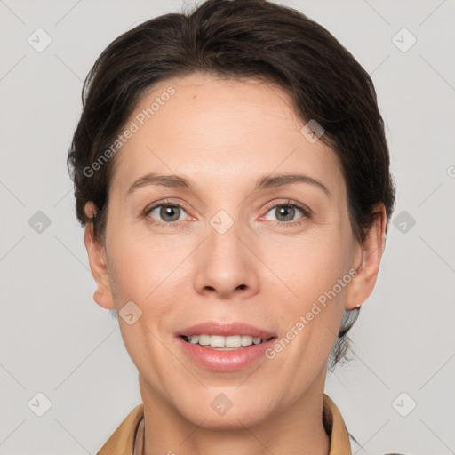 Joyful white adult female with short  brown hair and grey eyes