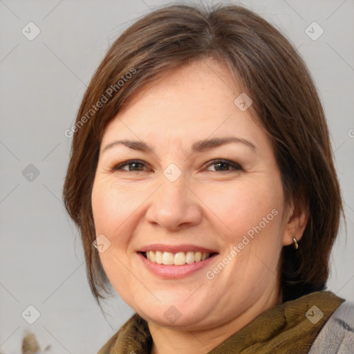 Joyful white adult female with medium  brown hair and brown eyes