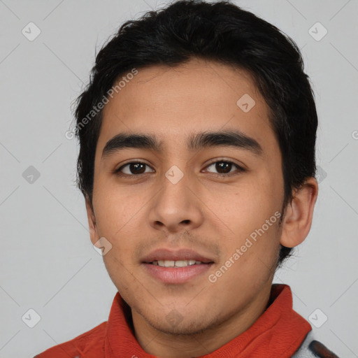 Joyful latino young-adult male with short  black hair and brown eyes