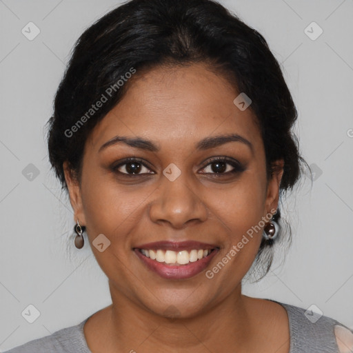 Joyful black young-adult female with short  brown hair and brown eyes