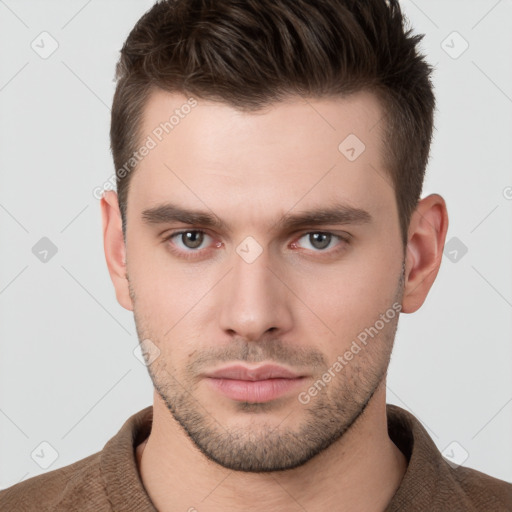 Neutral white young-adult male with short  brown hair and brown eyes