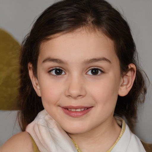 Joyful white child female with medium  brown hair and brown eyes