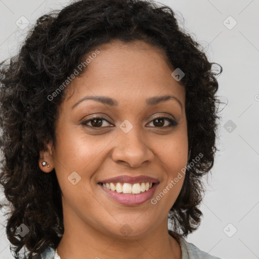 Joyful latino young-adult female with long  brown hair and brown eyes