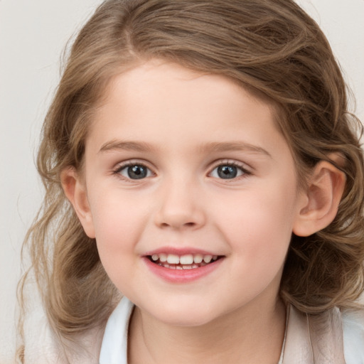 Joyful white child female with medium  brown hair and grey eyes