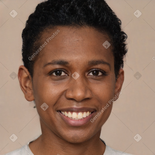 Joyful black young-adult female with short  black hair and brown eyes