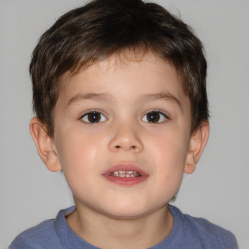 Joyful white child male with short  brown hair and brown eyes