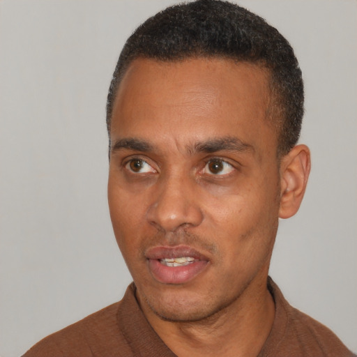 Neutral black adult male with short  black hair and brown eyes