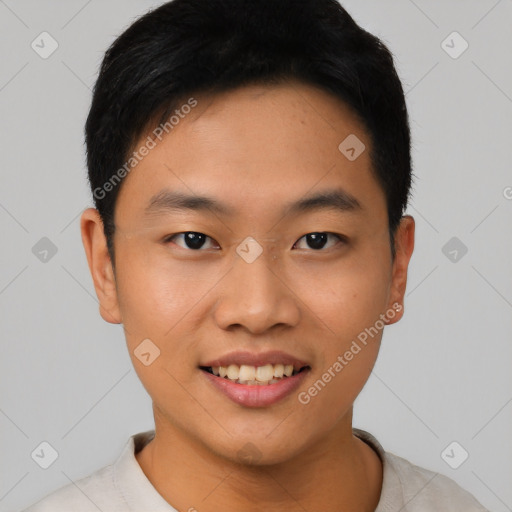 Joyful asian young-adult male with short  black hair and brown eyes