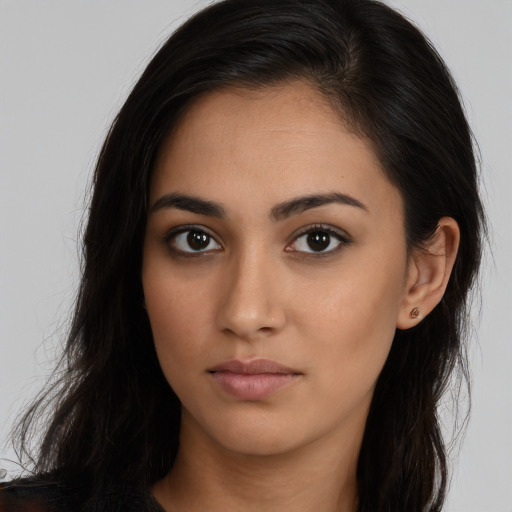 Neutral latino young-adult female with long  brown hair and brown eyes