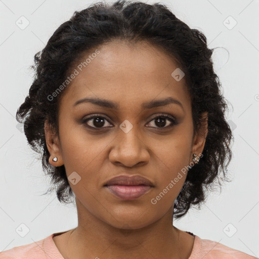 Joyful black young-adult female with long  brown hair and brown eyes