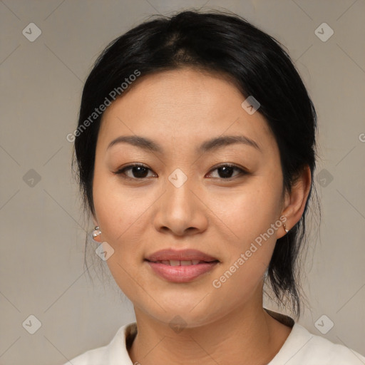 Joyful asian young-adult female with medium  black hair and brown eyes