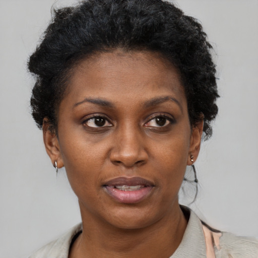 Neutral black young-adult female with short  brown hair and brown eyes