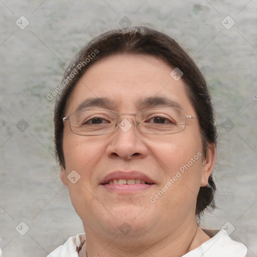 Joyful white adult female with short  brown hair and brown eyes