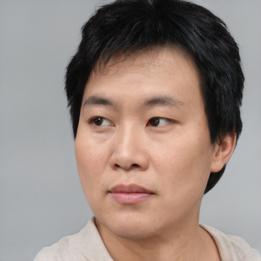 Neutral asian young-adult male with short  black hair and brown eyes