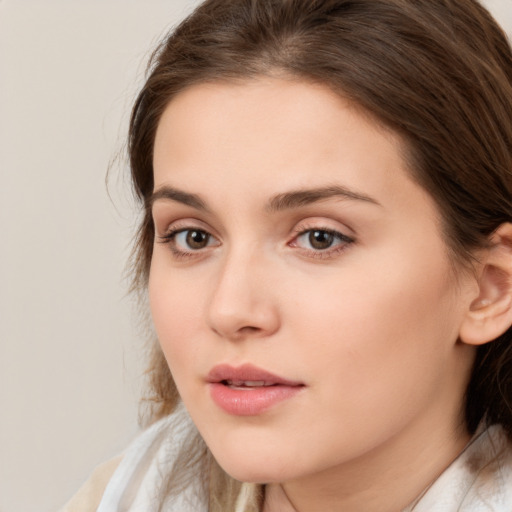 Neutral white young-adult female with medium  brown hair and brown eyes