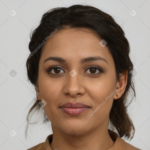 Joyful latino young-adult female with medium  brown hair and brown eyes