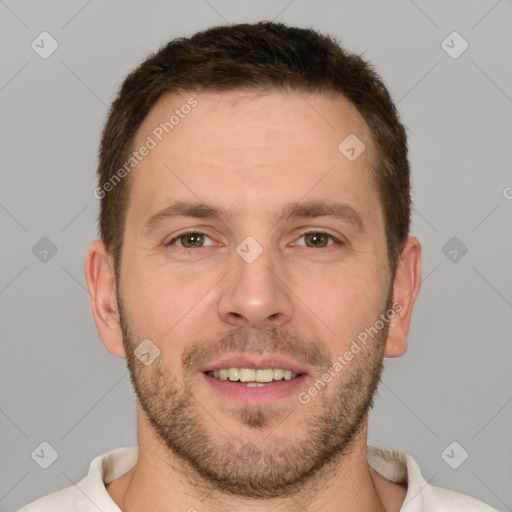 Joyful white young-adult male with short  brown hair and grey eyes