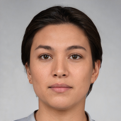 Neutral white young-adult female with short  brown hair and brown eyes