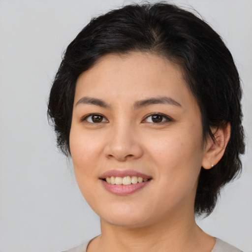 Joyful white young-adult female with medium  brown hair and brown eyes