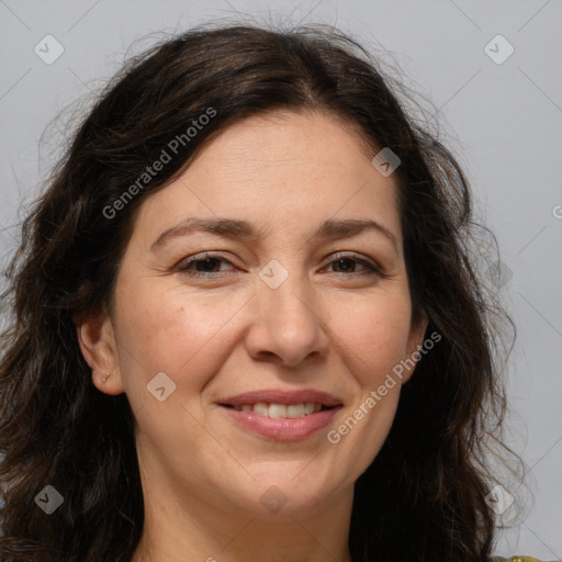 Joyful white adult female with long  brown hair and brown eyes