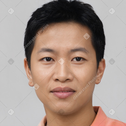 Joyful asian young-adult male with short  black hair and brown eyes