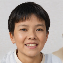 Joyful white child male with short  brown hair and brown eyes