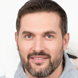 Joyful white young-adult male with short  brown hair and brown eyes