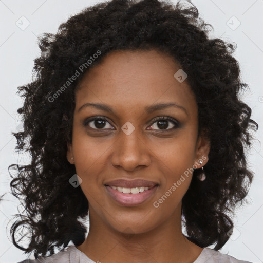 Joyful black young-adult female with long  brown hair and brown eyes