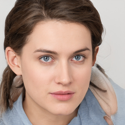 Neutral white young-adult female with medium  brown hair and grey eyes