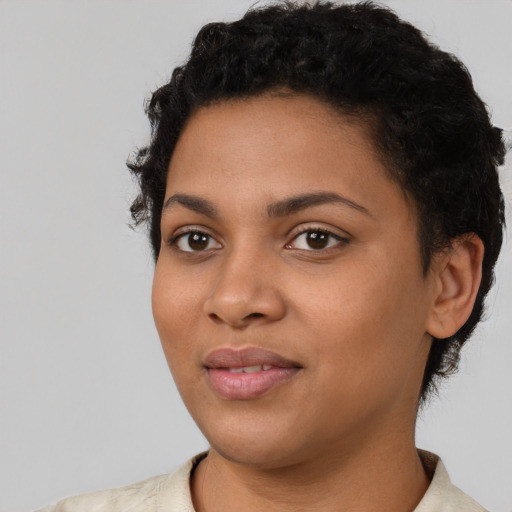 Joyful latino young-adult female with short  black hair and brown eyes