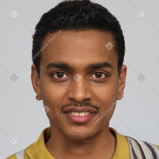 Joyful black young-adult male with short  black hair and brown eyes