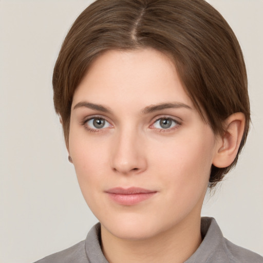 Neutral white young-adult female with short  brown hair and brown eyes