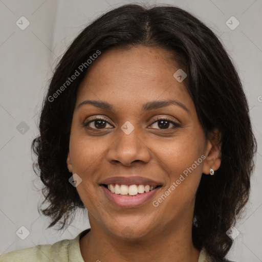 Joyful black young-adult female with medium  brown hair and brown eyes