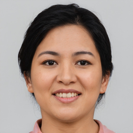 Joyful asian young-adult female with medium  brown hair and brown eyes