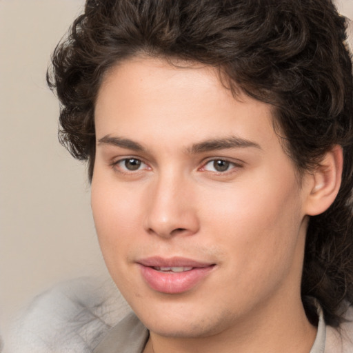 Joyful white young-adult male with medium  brown hair and brown eyes