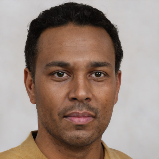 Neutral latino young-adult male with short  black hair and brown eyes