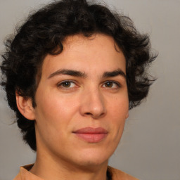 Joyful white young-adult male with medium  brown hair and brown eyes