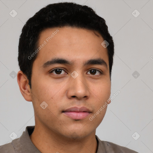 Neutral latino young-adult male with short  black hair and brown eyes