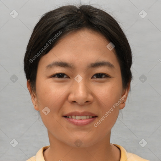 Joyful asian young-adult female with short  brown hair and brown eyes