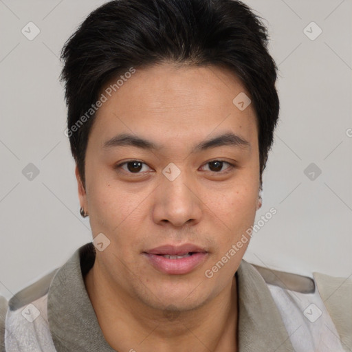 Joyful asian young-adult male with short  brown hair and brown eyes