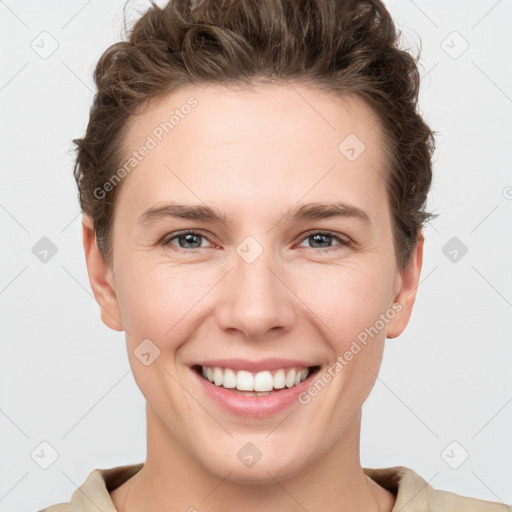 Joyful white young-adult female with short  brown hair and grey eyes