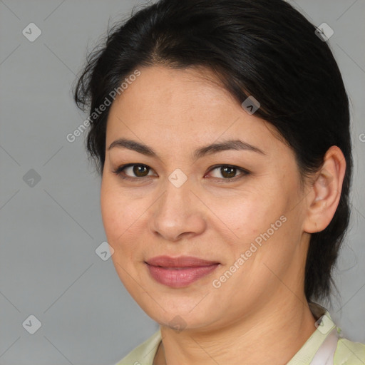 Joyful asian adult female with medium  brown hair and brown eyes