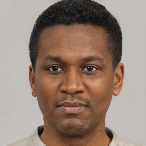Neutral black young-adult male with short  black hair and brown eyes
