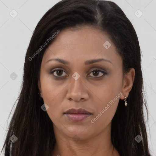 Joyful black young-adult female with long  brown hair and brown eyes