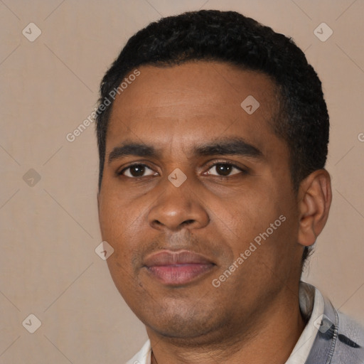 Joyful black young-adult male with short  black hair and brown eyes