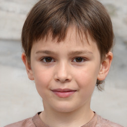 Joyful white child female with short  brown hair and brown eyes