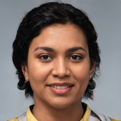 Joyful latino young-adult female with medium  black hair and brown eyes