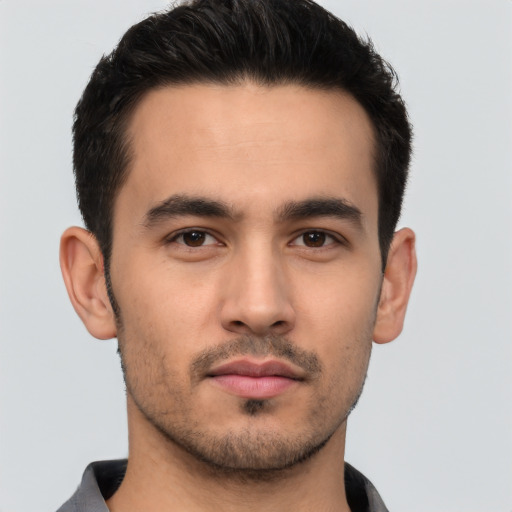 Neutral white young-adult male with short  black hair and brown eyes