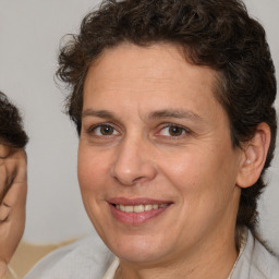 Joyful white adult female with short  brown hair and brown eyes