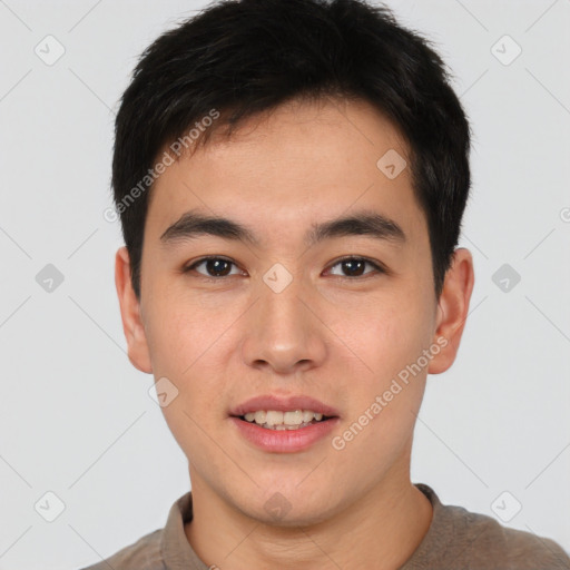 Joyful asian young-adult male with short  brown hair and brown eyes